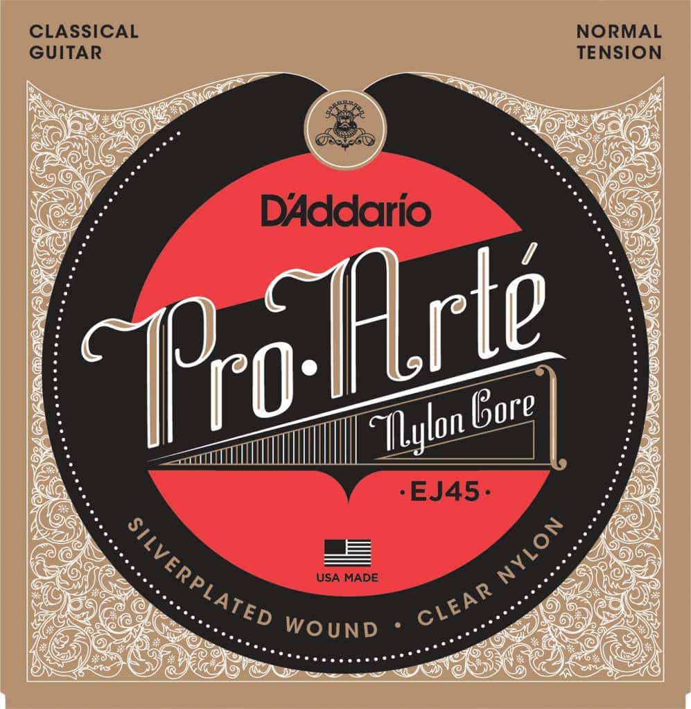 Bright red and black classical guitar string packaging featuring the D'Addario Pro-Arté logo, nylon core, and USA Made label on a decorative background.
