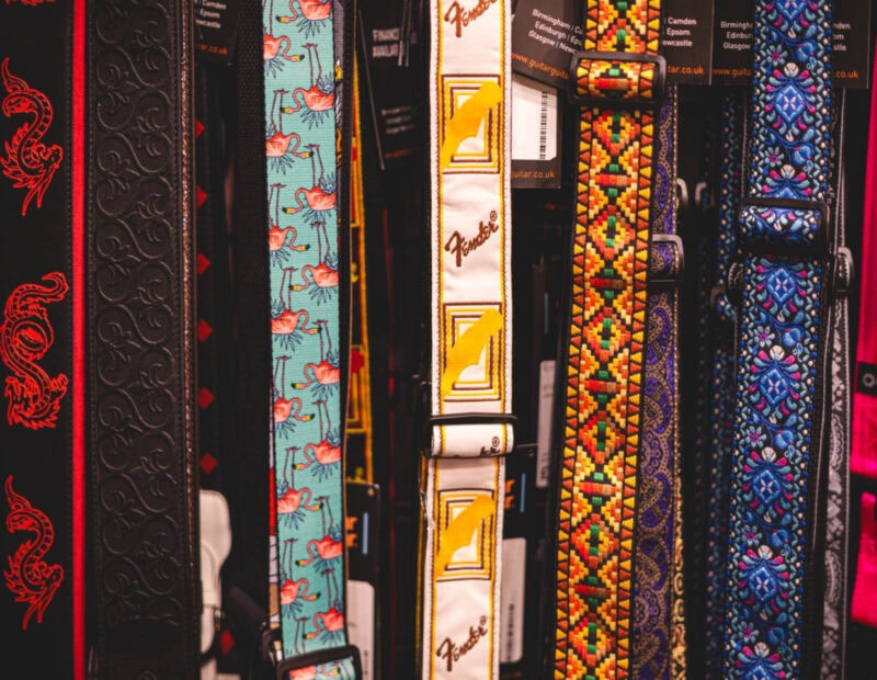 Leather belts with vibrant designs and patterns displayed at The Music Outlet in Swords, Dublin. Perfect for adding a colourful touch to any outfit or musical performance attire.